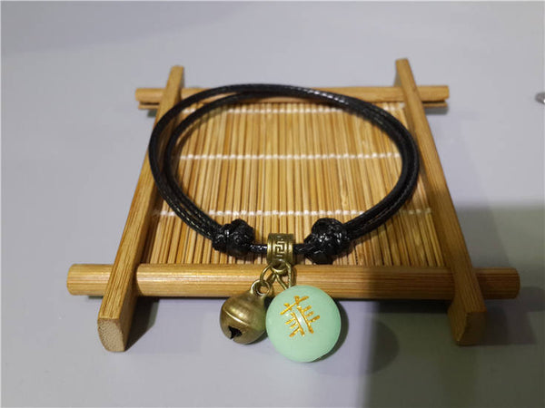 Bracelet artisanal lumineux Bouddhiste personnalisable, créez vous un bijou unique !  Personnalisez la pierre lumineuse de votre bijou avec la lettre, le chiffre, le signe chinois ou le symbole de votre choix.